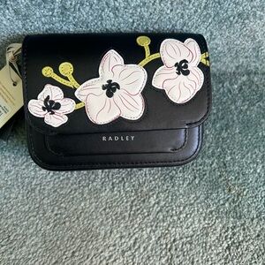 RADLEY LONDON Black Crossbody Bag with White and Pink Floral Accents